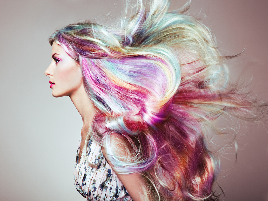 Woman with colorful long hair extensions in Atlantic City blowing in the wind.